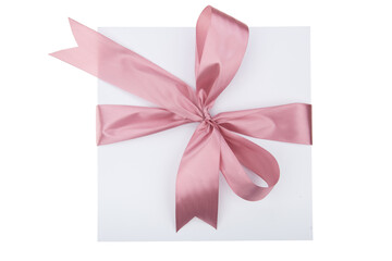 White gift box with pink ribbon on white background. Top view.