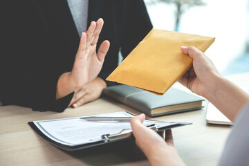 Government officials refusing money to take the bribe money from business man the concept of...