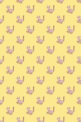 Vertical pattern of striped brown cats with proudly raised tail on a yellow background. Positive.