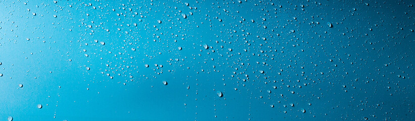 splash of water on a blue background. Abstract wallpaper