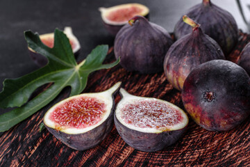 Fresh ripe figs on a dark concrete background. Harvesting figs