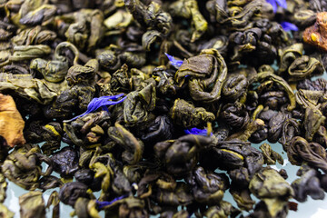 green tea leaves on a white background close up
