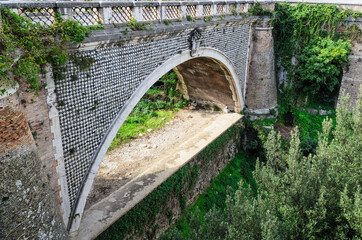 Ponte Gregoriano Bridge over the Aniene River. Tivoli, Italy