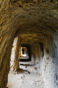Tunnel hollowed out in a rock over the gorge of the Aniene river next to the Villa of Manlio Vopisco. Tivoli, Italy