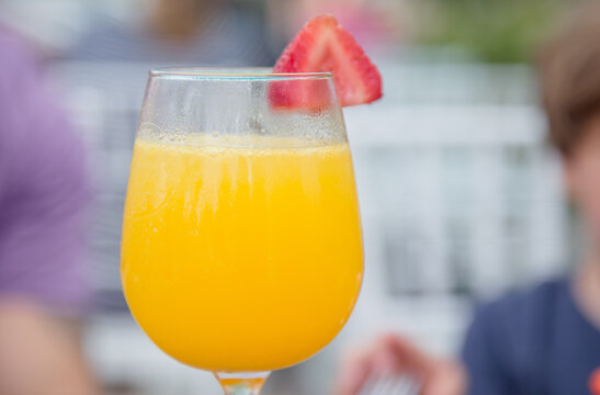 Glass Of Orange Juice With Straw Berry Mimosa Brunch Dorines In Marco Island 