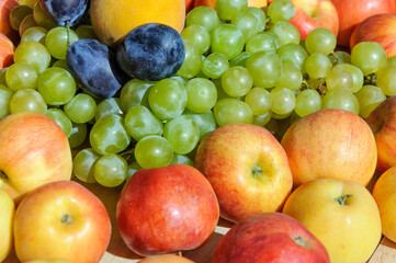 Fruits: grapes, apples, plums, peach. Ingredients of a healthy diet.