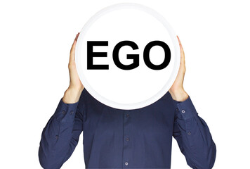 The inscription ego in black letters on a white circle in the hands of a man on a white background.
