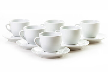 Six white coffee cups and saucers