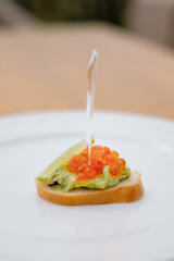 Decorated catering banquet menu with different food snacks and appetizers with sandwich.