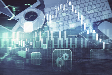 Double exposure of forex chart hologram over desktop with phone. Top view. Mobile trade platform concept.
