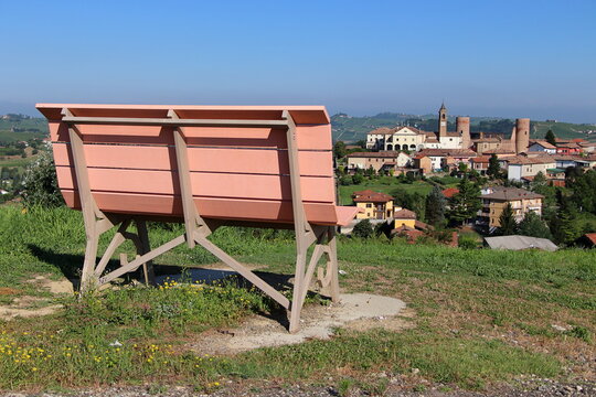 Big pink benches fancing the Monferrato hills.