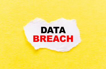 the inscription DATA BREACH on a white torn piece of paper on a yellow background