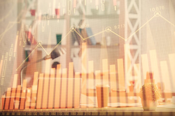 Double exposure of stock market graph drawing and office interior background. Concept of financial analysis.