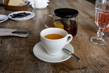 breakfast with tea and pies on a brown table