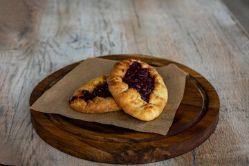 breakfast with tea and pies on a brown table