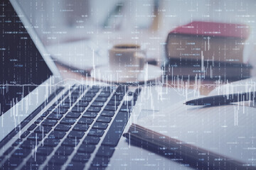 Double exposure of financial chart drawing and desktop with coffee and items on table background. Concept of forex market trading