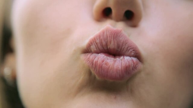 Female lips kissing in closeup