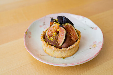 Close up of cute delicious Fig and Chocolate tart
