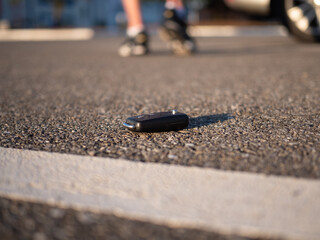 A man walking away after losing his car key on a parking