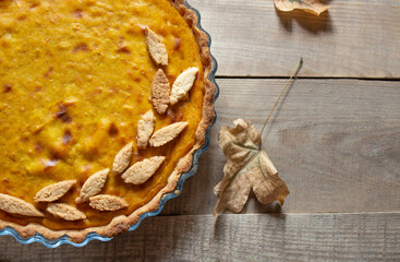 Thanksgiving pumpkin. traditional homemade pumpkin pie for the fall holiday. view from above. Autumn pie. leaves. copyspace