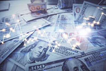 Fototapeta premium Multi exposure of forex chart drawing over us dollars bill background. Concept of financial success markets.