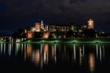 Fototapeta na wymiar Ilumination of Wawel Castle at night, Cracow, Poland