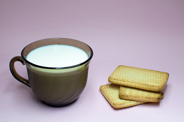Milk cup & Milk Cookies On pink Background