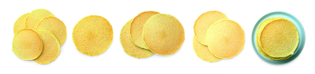 Tasty green pancakes on white background