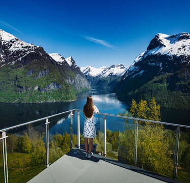 Norway - Girl at viewpoint - Møre og Romsdal - Geiranger © Grim
