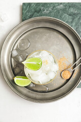 Glass of fresh mojito on table