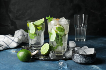 Glasses of fresh mojito on table