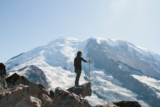 Young man hikes up mountain
