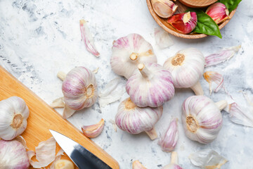 Composition with fresh garlic on light background