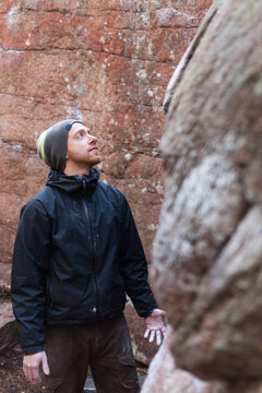 Climber visualizing boulder route