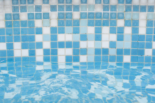 Close-up of blue and white pool mosaic