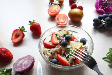 A Cup of vegetable salad with added berries, close - up-the concept of a healthy vegetable diet