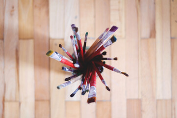 Top view of Jar filled with paint brushes
