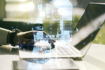 Double exposure of creative human head microcircuit with hand typing on computer keyboard on background. Future technology and AI concept