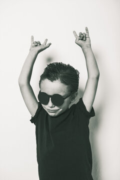 Portrait of heavy little boy with diy sunglasses.