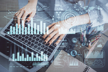 Double exposure of woman hands typing on computer and forex chart hologram drawing. Stock market...