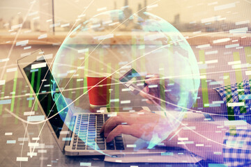 Double exposure of man hands holding a credit card and internet business theme drawing. Digital fintech and E-commerce concept.