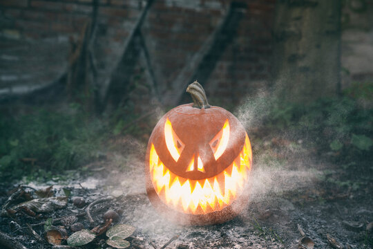 Outdoor explosion of light from carved pumkin on Halloween