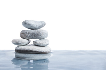 Stack of spa stones in water on white background