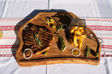 t-bone steak on wooden plate