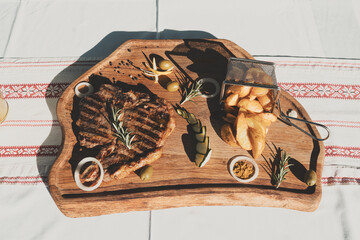 t-bone steak on wooden plate