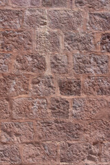 Old medieval red stone wall texture