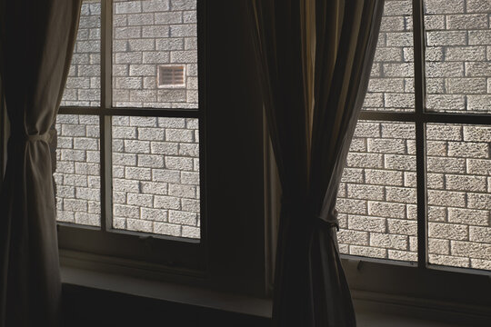 Window view with brik wall closer