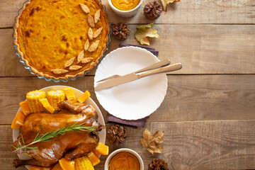 Thanksgiving Day. Thanksgiving Autumn background of pumpkin pie and chicken. thanksgiving. View from above. Copyspace