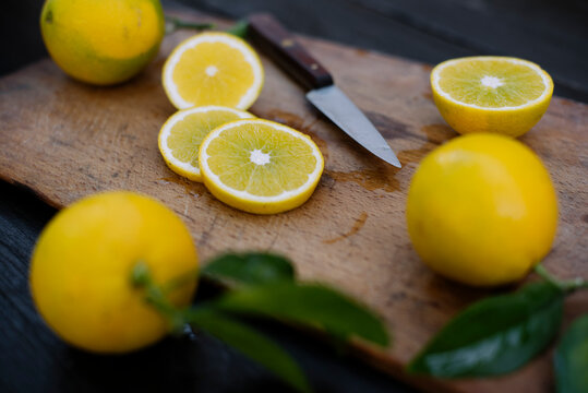 Food: sliced lemons on wooden board