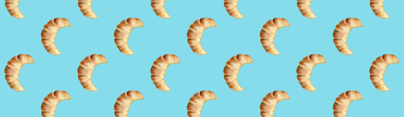 Bright creative banner. Painted croissants on a blue background. Design for websites or social media. Watercolour illistration.
